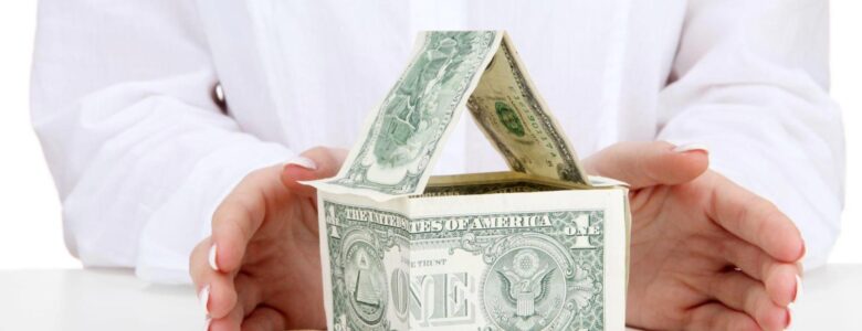 Hard money loan financing concept showing a California house model next to stacks of cash, representing ARC Private Lending real estate funding.