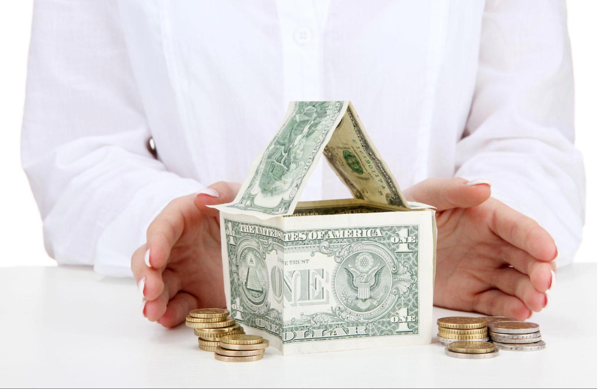 Hard money loan financing concept showing a California house model next to stacks of cash, representing ARC Private Lending real estate funding.