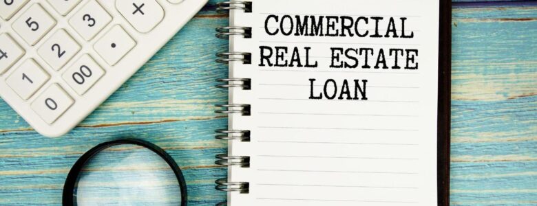 Commercial loan refinancing documents, calculator, and building plans representing ARC Private Lending’s Los Angeles lending solutions